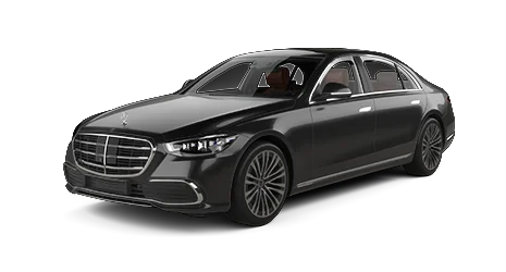 A black Mercedes-Benz luxury sedan is shown from a front-side angle, featuring sleek lines, a prominent grille, and multi-spoke alloy wheels on a plain white background.