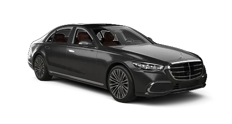 A black Mercedes-Benz luxury sedan is shown from a front-side perspective, displaying its elegant body design, signature grille, and multi-spoke wheels on a plain white background.